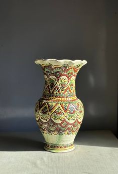 a decorative vase sitting on top of a table