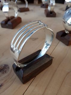 a metal object sitting on top of a wooden table