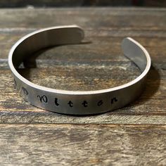 Hello Fur Baby Mamas! You cannot go wrong with this beautifully hand stamped aluminum cuff bracelet, personalized with your fur baby’s name. Made with premium quality aluminum, this bracelet is not only beautiful but also light weight and comfortable. With a width of 3/8” and circumference of 6”, it has enough space to write your words in upper case or lower case letters. (Please specify your choice in a message otherwise I will choose the best fit) Product Description: • Aluminum Bracelet • Wid Personalized Cuff Bracelets, Aluminum Bracelets, Animal Bracelet, Baby Bracelet, Lower Case, Upper Case, Lowercase A, Lower Case Letters, Hand Stamped