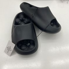 Sole Mates Black Slip On Cushion, Slides Sandals Unisex Size 7 New With Tags See Pic Bs142/24 Shoes C27 Mh4 Slip-on Sandals With Textured Sole For Streetwear, Black Slide Sandals With Rubber Sole, Black Summer Slides With Rubber Sole, Black Summer Slippers With Removable Insole, Casual Black Synthetic Flip Flops, Black Non-slip Sport Sandals For Streetwear, Black Sport Sandals With Flat Heel For Spring, Black Non-slip Flat Slippers, Black Flat Heel Sport Sandals For Spring