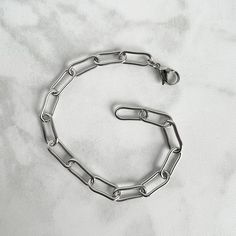 Larger link paperclip chain bracelet, in hypoallergenic stainless steel, which will not tarnish and is great for those with a sensitivity to metals! DETAILS * stainless steel chain with 17x7mm links * 15mm stainless steel lobster clasp Smaller link chain also available! https://www.etsy.com/listing/1199174836/stainless-steel-paperclip-bracelet?click_key=1a9f03fe8756a9fce6475840d5ecb4ee4c632cf5%3A1199174836&click_sum=2a64581f&ref=shop_home_active_1&frs=1&crt=1&sts=1 *Please measure accurately! Br Modern Metal Bracelets With Paperclip Chain, Metal Paperclip Bracelet With Chunky Chain Link, Modern Metal Bracelet With Paperclip Chain, Minimalist Metal Chain Bracelet With Rectangular Links, Minimalist Metal Chain Bracelet With Oval Links, Minimalist Metal Link Chain Bracelet, Metal Paperclip Bracelet With Chunky Oval Link, Everyday Silver Chain Link Paperclip Bracelet, Modern Metal Paperclip Bracelet With Adjustable Chain