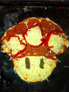 a pizza with pepperoni, cheese and sausage on it's face made to look like a smiley face