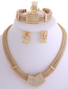 "Unique and simply stunning statement jewelry, spice up any outfit with this gorgeous accessory for all occasion. Super cute! New Gold Plated 3T Tone Metal Necklace Bracelet Earring Set / Necklace Approx 15.5\" L plus 2.5\"EXT / Bracelet approx 7.5\"L plus 1.5\"EXT / Earring: Post Clip 2.5\"L / Ring: Adjustable / Color: Three Tone Product contains 5 items: 1 Necklace, 2 Earrings, 1 Ring and 1 Bracelet.  Party wear, ceremonial occasion, African Party, wedding, birthday and More!  Quick Note; Stock Photo is high contrast picture with high definition color grade." Luxury Multicolor Jewelry Sets For Gifts, Luxury Dual-tone Jewelry For Festivities, Luxury Gold-plated Jewelry With Rhinestones, Luxury Gold Jewelry Sets For Festive Occasion, Luxury Dual-tone Jewelry For Festivals, Luxury Dual-tone Jewelry For Celebration, Cheap Gold Sets For Navratri, Bracelet Party, Fancy Jewellery Designs