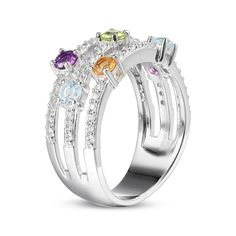 three stone ring with multicolored stones on the sides and two rows of white gold