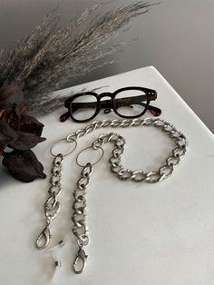 "Oversized O ring light grey glasses chain, sunglasses bold chain holder, aluminum statement chain layered necklace, chunky curb chain holder Welcome to my shop! ✈️ DHL EXPRESS SHIPPING AVAILABLE, 1-3 BUSINESS DAYS DELIVERY! ✔️ PLEASE MAKE SURE TO SELECT IT, RIGHT BEFORE YOUR PURCHASE! ❗️ ❗️ DON'T FORGET TO ADD YOUR CELL # AT THE \"NOTE TO SELLER\" SECTION IF YOU CHOOSE DHL! BY FILLING YOUR CELL NUMBER YOU EARN THE BENEFIT TO CHOOSE BETWEEN 6 DIFFERENT DELIVERY OPTIONS! INSTRUCTIONS WILL BE SENT Metal Glasses Chains As Gift, Modern Silver Glasses Chains As Gift, Modern Silver Glasses Chains For Gift, Modern Metal Glasses Chains With Adjustable Chain, Trendy Metal Glasses Chains With Chain Strap, Adjustable Silver Metal Glasses Chains, Silver Adjustable Chain Glasses Chains, Adjustable Silver Glasses Chain With Chain Strap, Silver Adjustable Glasses Chain