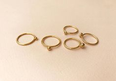 Bell rings. by Studio Baladi Minimalist Brass Toe Ring, Handmade Stackable Rings For Everyday Wear, Everyday Handmade Stackable Rings, Minimalist 14k Gold-filled Stackable Toe Rings, Modern Handmade Stackable Rings For Everyday, Minimalist Stackable 14k Gold-filled Toe Rings, Minimalist Brass Stackable Toe Rings, Elegant Stackable Brass Midi Rings, Minimalist 14k Gold Filled Stackable Toe Rings