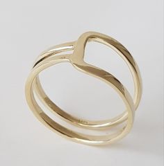 14K solid gold ring in a minimalist style for lovers of geometric shapes. ◈ DETAILS Weight: 3g Width upper part-9mm / 0.35'' Thickness-1.3 mm / 0.05'' ◈ MATERIAL 14K Solid Gold - Smooth,shiny,plain surface ◈ ALSO AVAILABLE IN 14K/18K/9K Yellow, Rose, or White Gold ◈ ENGRAVING is optional ◈ SHIPPING is insured express and free worldwide ◈ GIFT WRAPPING is included with every purchase ✧ Back to my shop for more handcrafted gold jewelry: https://etsy.me/38Cs5Zl If you have any questions, I will be Modern Gold Initial Ring With Open Band, Modern Stackable Rings With Open Band For Gift, Adjustable Yellow Gold Stackable Rings Modern Style, Modern Adjustable Yellow Gold Stackable Rings, Modern Stackable Open Band Rings As Gift, 14k Gold Minimalist Couple Rings With Open Design, 14k Gold Minimalist Open Couple Rings, Minimalist 14k Gold Couple Rings With Open Design, Modern Adjustable Initial Ring