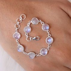 "Rainbow Moonstone Bracelet, 925 Solid Sterling Silver Bracelet, June Birthstone Bracelet, Round Gemstone Bracelet, Handmade Silver Jewelry Gemstone - Rainbow Moonstone  Stone Quality - AAA  Weight - 5.80 gm  Stone Length - 0.7 cm , Width - 0.7 cm  Bracelet Length - 6 inch to 9 inch sizes are available, we give 0.5 inch adjustable in the size which you order ( NOTE - 0.5 INCH ADJUSTABLE IS INCLUDED IN YOUR ORDERED SIZE ) Stone Shape - As shown in the picture We serve complete 925 sterling silver Jewelry and genuine properties of the stone. The products are dispatched from the small business from UK. Product Quality and Packaging - Our all products are 925 Silver Stamped which shows that the product is genuine and authentic .The products are dispatched from the small business from UK so you Silver Round Moonstone Crystal Bracelet, Elegant Adjustable Sterling Silver Moonstone Bracelet, Adjustable Silver Multi-stone Bracelet, Elegant Sterling Silver Multi-stone Bracelet, Silver Moonstone Meditation Bracelet, Adjustable Jewelry, Hippy Gifts, Moonstone Stone, Moonstone Bracelet