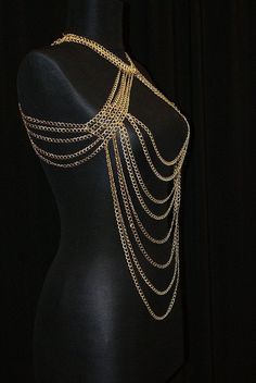 Here's a great and totally unique body chain necklace that makes the old 'little black dress' take on a whole different meaning! This gold body chain as I like to call it, adds the perfect amount of deco to your once all too simple party dress. It also looks great worn over a loose shirt, with jeans, conforming to the body in all the right places. Its great for a cocktail party or a night out at the clubs, this is definitely an attention grabbing piece. Would you like to see more body chain jewe Gold Harness, Wardrobe Build, Body Chain Fashion, Full Body Chain, Body Chain Necklace, Boho Jewelry Bracelet, Body Necklace Chain, Body Chain Harness, Chain Harness