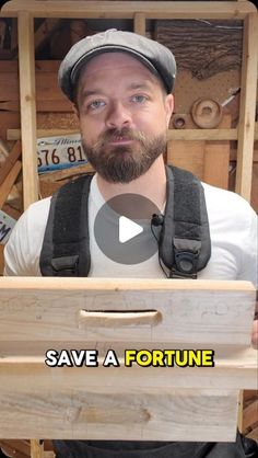 a man holding a wooden box with the words save a fortune in front of him