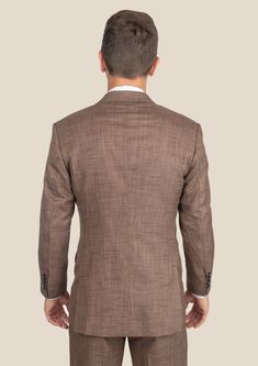 Be the best dressed at your next event with the Tawny Brown Hopsack Suit. This cool and stylish suit exudes elegance and luxury. Custom made from a luxurious bamboo/wool/linen/silk blend from Cavani, you're guaranteed to look as good as you feel. Dress to impress with this must-have suit. Elegant Linen Tweed Jacket With Welt Pockets, Luxury Linen Tweed Jacket With Notch Lapel, Timeless Linen Blazer For Business, Elegant Linen Suits With Notch Lapel, Luxury Single Breasted Linen Sport Coat, Luxury Linen Single Breasted Sport Coat, Formal Linen Sport Coat With Welt Pockets, Formal Linen Blazer With Suit Collar, Formal Linen Tweed Jacket With Long Sleeves