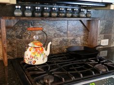 a tea kettle sitting on top of a stove