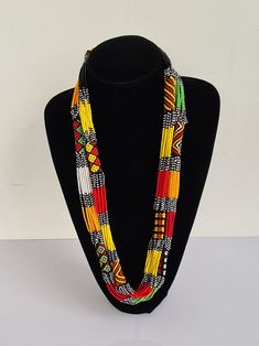 This necklace is 100% handcrafted using colorful fine beads. **Listing is for 2 necklaces like shown above. They make a perfect gift to loved ones. Dimensions; 32 inches. **Buy multiple items and pay shipping for 1 item only.The rest ships free. Custom orders are welcome. More neckleces here; https://www.etsy.com/shop/TribalTess?ref=seller-platform-mcnav&section_id=21306083 Back to my shop; https://www.etsy.com/shop/TribalTess?ref=seller-platform-mcnav Traditional Multicolor Beaded Necklaces As Gift, Traditional Colorful Beaded Necklaces As Gift, Unique Multi-strand Colorful Beaded Necklaces, Yellow Multi-strand Necklace For Gift, Adjustable Multicolor Beaded Necklaces For Gifts, Unique Multicolor Beaded Chain Necklaces, Unique Multicolor Beaded Necklaces, Unique Multicolor Beaded Necklace, Multicolor Beaded Chain Necklace For Festival