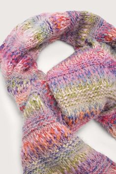 Stay warm and stylish with our Multicolored Knit Scarf. Crafted from soft, cozy knit fabric, this scarf features a beautiful gradient of red, orange, pink, green, blue, and purple hues. The fading design adds a touch of sophistication while still providing a vibrant pop of color. Pair it with our matching Multicolored Knit Beanie for a complete look. Perfect for chilly days in the city or any occasion where you need extra warmth and style. Made in India Multicolor Scarves For Cold Weather In Fall, Cozy Multicolor Scarves For Cold Weather, Colorful Knit Scarf, Warm Multicolor Scarves For Fall, Warm Multicolor One-size Scarves, Warm Multicolor Casual Scarves, Warm Multicolor Winter Scarves, Warm Casual Multicolor Scarves, Casual Warm Multicolor Scarves