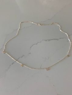 This 14K Gold MAMA Necklace is a beautiful, handcrafted piece of jewelry ideal for everyday wear. It is crafted exclusively in 14K yellow gold and can be combined with other necklaces for a layered look. Perfect for any special occasion like Valentine's Day, Mother's Day, Birthdays, Anniversaries and Christmas.♦ Materials: 14K Yellow Gold♦ Available colors: Yellow Gold♦ Necklace measurements: 16"-18" inches♦ Letters Measurement: 5MM height--------------------------------------------------------- Luxury Sterling Silver Charm Necklace For Everyday, Dainty Sterling Silver Custom Necklace For Everyday, Everyday Dainty White Gold Name Necklace, Dainty Sterling Silver Necklace For Everyday, Dainty White Gold Name Necklace, Classic Silver Name Necklace With Delicate Chain, Silver 14k Gold Initial Pendant Necklace, Silver Custom Necklace In Dainty Style, Dainty 14k Gold Necklace In Silver Color