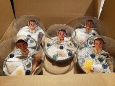 there are six plastic bowls with pictures of people in the sea on them and seashells