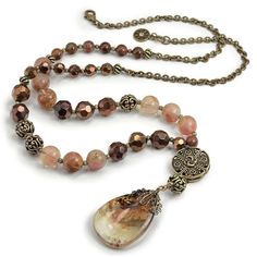 "Substantial and rich looking, this necklace is created with 8, 10 and 12mm natural gemstone beads, vintage facted glass beads and metal beads we cast from old Roman artifacts. The beads transition to an engraved oval link chain to the back. The strand is 34\" and the pendant beads drop another 4\". Made at Sweet Romance in our Los Angeles studio. Options: BLUE-GREEN Natural malachite and azurite, chrysocola, vintage indigo blue faceted beads. Silver metal beads and chain. (3rd photo shows neckl Roman Artifacts, Bead Pendant Necklace, Autumn Jewelry, Sundance Style, Necklace Ideas, Necklace Tutorial, Gemstone Beaded Necklace, Sweet Romance, Bead Pendant