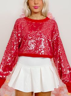 The Swear By Sequins Sweater from Sassy Shortcake is a red sweater. She features shiny clear sequins that give her an extra pop in every light!! Also available in hot pink and green. fit: runs true to size (model wearing a size small) content: 100% acrylic. care: hand wash cold.