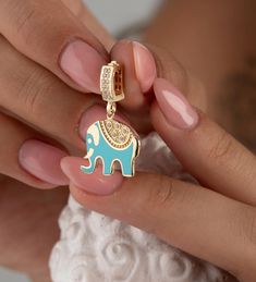 The 14K Gold CZ Elephant Pendant Necklace sounds like a beautiful and elegant piece of jewelry, perfect as a lucky charm or a thoughtful birthday gift. Animal-themed jewelry often carries symbolic meaning and makes for a unique gift, especially for someone who appreciates both style and symbolism. It's lovely for bridal gifts as well, offering a touch of elegance and sentimentality. If you prefer a thicker chain, please contact us. Product Features: * Made to Order: Crafted specifically to your Elegant Jewelry With Charms For Celebration, Elegant Dangle Jewelry For Good Luck, Handmade Yellow Gold Charms As Gifts, Gold Plated Pendant Charms As Gift, Fine Jewelry Charms For Gifts, Elegant Jewelry With Dangling Charms For Good Luck, Elegant Handmade Charms For Gifts, Elegant Hallmarked Charms For Gifts, Fine Jewelry Pendant Charm For Gifts