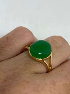 Vintage Lucky Green Nephrite Jade ring Fun jade is color enhanced Large green nephrite jade Ornate German Gold finished Vintage ring, does not tarnish, NOT sterling Size 5.75, 6, 7, 8, or 9 All rings are shipped free in the US in a nice gift box. Check out our over a THOUSAND great reviews Engraving is $4 per letter and is not always perfect depending on the piece. It can take a few days if the jeweler is busy. This is payable to Paypal Judithsltd@gmail.com Green Oval Rings With Natural Stones, Green Rings With Natural Stones, Green Natural Stones Ring, Green Emerald Oval Cabochon Ring, Green Emerald Ring With Oval Cabochon, Green Jade Rings With Natural Stones, Oval Jade Ring With Natural Stones, May Birthstone Emerald Ring With Natural Stones, Green Onyx Emerald Ring