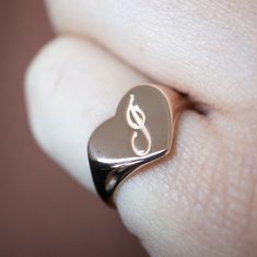 The heart signet ring is a classic, and this one is personalized with an inset monogram. This item is engravable with text or monogram of your choice at no extra cost. The initals are engraved onto the ring and embedded in the 3D model for a flawless embossed finish. You may choose to customize this ring with different images, letters or words. A render of your custom design will be sent to you before production. Heart width: 12mm Heart height: 10mm A few notes about our gold: - Though we do not Symbolic 14k Gold Initial Ring With Polished Finish, Classic Heart-shaped Signet Ring For Wedding, Classic Heart Ring For Valentine's Day, Personalized Heirloom Rose Gold Initial Ring, Classic Heart-shaped 14k Gold Signet Ring, Classic Heart Shaped 14k Gold Signet Ring, Classic 14k Gold Heart-shaped Signet Ring, Classic Heart-shaped Sterling Silver Engraved Ring, Heart-shaped Signet Ring With Polished Finish For Anniversary