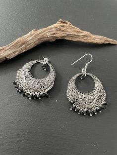 Indus Earrings : Back to our Roots. For the women who makes a statement.  An exclusive shop for earrings. Wear them with pride.  These are dangling drops style earrings . An unique handmade Indian style ethnic bohemian/ Tribal earrings in silver shade.  These earrings are made from high quality Tatanium / German silver material  which are hypoallergenic and free from corrosion & rusting.  Notes : The product shipped will be same as shown in the picture, however the actual colours may vary slight Bohemian Earrings With Dangling Beads, Bohemian Round Earrings With Dangling Beads, Silver Beaded Earrings With Dangling Beads For Festival, Traditional Chandelier Earrings With Dangling Beads, Bohemian Teardrop Oxidized Earrings, Bohemian Teardrop Dangle Earrings With Oxidized Finish, Bohemian Oxidized Teardrop Dangle Earrings, Traditional Dangling Beads Drop Earrings, Bohemian Silver Oxidized Teardrop Earrings