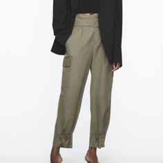 High Waisted Pants With Front Pleats And Self Belt. Front Pockets And Side Flap Patch Pockets. Adjustable Hem With Straps. Front Zip And Metal Hook Closure. Khaki 8277/411 Utility High-waisted Pants With Belt Loops, Khaki High-waisted Pants With Patch Pockets, Khaki High-waisted Pants With Belt Loops, Yellow Linen Pants, High-waisted Khaki Cargo Pants With Elastic Waistband, Khaki High-waisted Cargo Pants With Elastic Waistband, Tropical Pants, Hot Pink Pants, High Waisted Cargo Pants