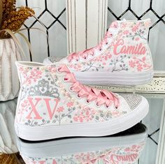 🌸 Step into your Sweet Sixteen or Quinceañera party with an air of elegance and panache, courtesy of our exquisite Flowers Style Custom Converse Shoes. These aren't your run-of-the-mill sneakers; they've undergone a regal transformation exclusively for your special birthday celebration. 🌸 Who says sneakers can't be both sophisticated and comfortable? Well, we're tossing that rulebook out the window! Our Converse shoes are tailor-made for dancing the night away without any foot-related concerns Quinceanera Shoes Sneakers & Athletic, Quinceanera Custom Shoes, Light Pink Quince Heels, Quince Shoes Sneakers Pink, Quince Custom Shoes, Rose Gold Converse Shoes, Converse Quinceanera Shoes, Quince Sneakers Pink, Quince Shoes Converse