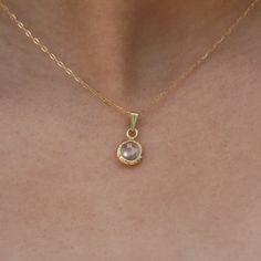 Dainty 14K gold filled CZ solitaire pendant necklace. The Cubic zirconia stone is wrapped in gold filled and hanged on a 14K gold filled necklace. Gemstone is available in a few colors. This delicate women solitaire jewelry fits any outfit or occasion day or night. Classic little bezel necklace that gives an elegant touch to your daily outfit. All components are nickel free. ◆ DETAILS  Chain: 14K gold filled Pendant: CZ stone (cubic zirconia) wrapped in 14K gold filled - 0.31"x0.31" (=8mm X 8mm) Charm Color: Clear (transparent) , Red, Light green, Lavender Length: 16" inch to 20" inch 14 inches (35.5 cm): choker that wrap high around the neck 15 inches (38 cm): closely around the neck 16 inches (40.5 cm): at neckline 17 inches(43 cm): average length 18 inches (45.5 cm): at collar bone 19-2 Gold Birthstone Necklace Fine Jewelry, Gold Fine Jewelry Birthstone Necklace, Gold Birthstone Necklace With Round Stone, Gold Round Stone Birthstone Necklace, Gold Necklace With Round Cut Gemstone, Gold Gemstone Crystal Necklace For Wedding, Gold Crystal Gemstone Necklace For Wedding, Gold Round Cut Birthstone Necklace Fine Jewelry, Gold Round Cut Birthstone Necklace In Fine Jewelry Style