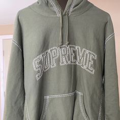 Dark Green Supreme Hoodie Never Worn Band New From The 2020 Summer Collection Oversized Hoodie With Embroidered Logo For Winter, Sporty Hoodie With Embroidered Logo For Spring, Oversized Winter Hoodie With Embroidered Logo, Winter Athleisure Hoodie With Embroidered Logo, Fall Streetwear Hoodie With Embroidered Logo, Winter Athleisure Sweatshirt With Embroidered Logo, Winter Crew Neck Hoodie With Embroidered Logo, Winter Long Sleeve Hoodie With Embroidered Logo, Winter Hoodie With Embroidered Logo And Crew Neck