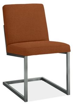 a brown chair with metal legs and an upholstered seat