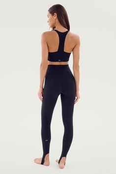 Our famous, form fitting high waist legging redesigned as a stirrup tight. Our ultra luxe Airweight fabric has a supremely soft hand and second skin comfort. BEST FOR: hot yoga, barre, Pilates. Model is 5'10" and wears a size small. Compressive Tights With Contoured Waistband For Pilates, Compressive Squat Proof Tights For Pilates, Compressive Tights For Training, Versatile Compressive Tights For Training, Compressive Training Tights, Compressive High Rise Sporty Tights, Sporty High Rise Compressive Tights, Sporty Compressive High Rise Tights, Functional Yoga Leggings With Contoured Waistband