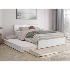 a white bed sitting on top of a wooden floor