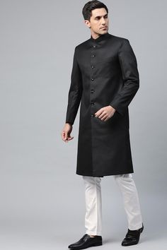 Product Features: Top Color: Black Bottom Color: White Work: Solid Top Fabric: Suiting Teri Cort Bottom Fabric: Art Silk Pack Of: 1 Sherwani and 1 Pant Occasion: Partywear Disclaimer: There will be slight difference in digital to actual image Festive Fitted Salwar Kameez For Semi-formal Occasions, Black Nehru Jacket With Zari Work, Black Straight Kurta Bandhgala For Festive Season, Festive Black Straight Kurta Bandhgala, Black Long Sleeve Designer Bandhgala, Traditional Black Straight Kurta Sherwani, Festive Semi-formal Traditional Wear With Pallu, Semi-formal Fitted Traditional Wear, Formal Unstitched Suit For Diwali