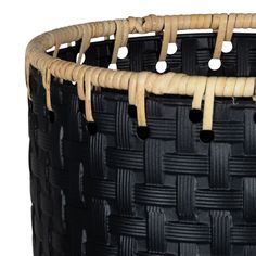 a close up of a woven basket on a white background