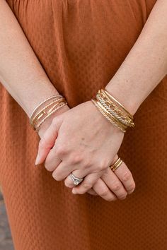 The Braided Gold Harmony Bangle Cuff Bracelet is the perfect bracelet if you love mixed metals. It is made of sterling silver and gold filled wires twisted together to make a stunning addition to your stack. (CHECK SIZING INSTRUCTIONS BELOW) *Non engraved orders may take up to 2-4 business days before shipping. Orders, including engraved jewelry items may take up to 3-5 business days. MOST COMMONLY ASKED QUESTIONS 1. What material is this bangle made of? .940 Argentium Sterling Silver, and 14K G Silver And Gold Bangles, Gold And Silver Bracelets Mixing, Stacked Gold Bracelets, Mixed Metal Bracelet Stack, Bracelet Styling, Bangle Stack, Mixed Metal Bracelets, Dope Jewelry Accessories, Classic Bangles