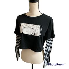 Anime Cropped T-Shirt. New Without Tags. Size Xl. Realistically Will Fit Womens Size 6-8. 65% Cotton 35% Polyester Alternative Crew Neck Tops With Front Print, Alternative Style Crew Neck Top With Front Print, Trendy Anime Print Tops For Streetwear, Edgy Black Tops With Anime Print, Edgy Anime Print Crew Neck Tops, Trendy Cotton Tops With Anime Print, Trendy Black Top With Character Print, Black Relaxed Fit Y2k Tops, Black Y2k T-shirt With Anime Print