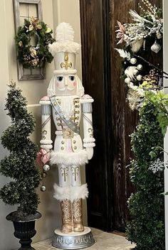 a nutcracker statue sitting in front of a door