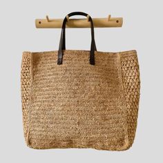 - The Nosi bag is our best seller - Piece made by hand in our Malagasy workshop - Woven by: Niry - Shoulder basket - Raffia exterior and genuine leather handles - Raffia interior with one pocket - Handle length: 22 cm - Non-adjustable handle in genuine leather - Bag weight: 0.5 kg - Dimensions size S Length 30 cm - height 29 cm - Depth 12 cm - Dimensions size M Length 36 cm - Height 38 cm - Depth 15 cm ▫️ NATURAL MATERIAL ▫️ HANDMADE ▫️ ECO-FRIENDLY Raffia Bag, Genuine Leather Bags, Leather Handles, Natural Material, Leather Handle, Best Seller, Purses And Handbags, Leather Bag, Shoulder Bags