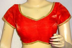 This is Red color Handmade Saree Blouse. Item is made in Dupion Fabric Size available from 32 to 50.  All blouses have two inches margin which can be open for further adjustments   We can do any type of alteration like short sleeves or long sleeves etc Shipping - The Order will be dispatched within 2-3 working days time. Standard (Free Shipping) Orders - Will be dispatched by Postal Service. It takes about 13 to 18 working days time for most locations worldwide. The Shipping is Free By Courier S Red Self-design Party Blouse, Red Party Blouse, Elegant Red V-neck Blouse Piece, Red Unstitched Blouse For Festivals, Red V-neck Blouse For Wedding, Bollywood Style Red Padded Blouse, Elegant Red Blouse With Self Design, Elegant Red Blouse For Festivals, Fitted Red Top With Self Design