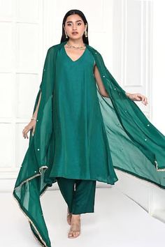 Rama green floral hand embroidered cape. Paired with an inner kurta and pant.
Components: 3
Pattern: Hand Embroidery
Type Of Work: Floral
Neckline: V neck
Sleeve Type: Sleeveless
Fabric: Kurta and Pant: Chanderi, Cape: Organza
Color: Green
Other Details: 
Model Height: 5ft 11inches, wearing size S
Length:
Kurta: 48 inches 
Pant: 37 inches
Attached inner lining
Approx. product weight: 0.750 kg
Occasion: Puja - Aza Fashions Chanderi Sets With Cape Sleeves For Eid, Green Straight Kurta Kaftan For Wedding, Festive Green Palazzo Set With Cape Sleeves, Elegant Kurta With Zari Work And Cape Sleeves, Traditional Kurta With Dabka Work And Cape Sleeves, Festive Kurta With Sheer Dupatta And Cape Sleeves, Anarkali Kurta With Cape Sleeves, Green Cape Sleeves Sets For Eid, Green Cape Sleeve Sets For Eid