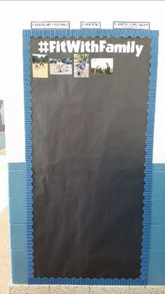 a bulletin board with pictures on it in front of a wall