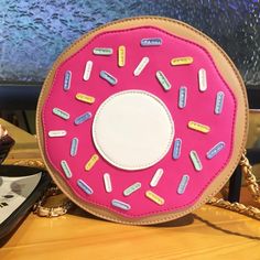 Fun bag Available in two pink color choices Donut Bag, Bag Light, Zipper Top, Cosmetic Pouch, Poker Table, Types Of Fashion Styles, Fun Bags, Color Choices, Donuts