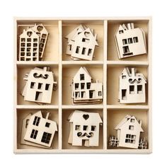 wooden cutout houses in a box on a white background with clippings for text