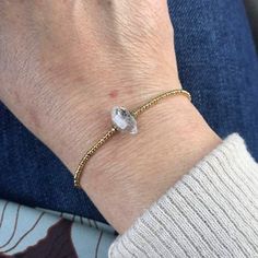 Simple but elegant, this gold beaded bracelet features a beautiful herkimer diamond surrounded by dainty 24k gold plated beads. Wear it to add a little statement to your outfit! Each stone is unique and varies slightly but measures approximately 10-11mm in width. Custom lengths available. Gold Faceted Beaded Bracelets For Everyday, Gold Dainty Beaded Bracelets With Faceted Beads, Gold Crystal Chain Bracelet As Gift, Faceted Rondelle Crystal Bracelet Gift, Faceted Gold Crystal Bracelet As Gift, Faceted Gold Crystal Bracelet, Dainty Gold Crystal Bracelet With Round Beads, Delicate Gold Faceted Beaded Bracelets, Yellow Gold Beaded Bracelets With Faceted Beads As Gift