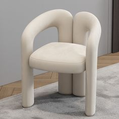 a white chair sitting on top of a carpet covered floor