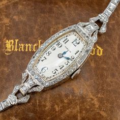 This exquisite circa 1930s Hamilton wristwatch (Style No. 989) features a diamond accented case and bracelet. The case is by the Wadsworth Watch Company (Case No. 0138038) and engraved details accent the side faces of the case and lugs. The case, lugs and bracelet are accented with a total of seventy- seven (77), bead set, round single cut diamonds. The case measures 16.5mm wide and 8.0mm thick. The silver colored dial features black Arabic numeral hour markers and blue steel hands. The movement Antique Engagement Rings Sapphire, Estate Jewelry Rings, Wedding Ring Diamond Band, Antique Costume Jewelry, Handsome Arab Men, Watches Luxury, Ladies Watches, Old Watches, Antique Watches