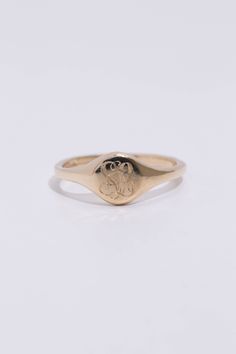 A classic hand engraved monogram ring. Solid 14k recycled gold. Signet face is 7.8mm round, and tapers to a 2.2mm band. 1-2 letters of your choosing engraved into the face. If you would like diamonds or other small birthstones inlaid into the ring, contact us here with the special request. This ring is made to order, please allow 3-4 weeks for delivery. Personalized Initial Ring In 14k Gold With Round Band, Personalized 14k Gold Initial Ring With Round Band, Personalized Engraved 14k Gold Ring, Minimalist 14k Gold Engraved Ring With Initials, Minimalist 14k Gold Monogram Rings, Wedding 14k Gold Signet Ring With Round Cut, Minimalist Monogram 14k Gold Rings, Minimalist 14k Gold Ring With Engraving Option, Engraved Diamond Ring In 14k White Gold