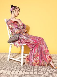 Slip into this fashionable kurta set and flaunt your glam style anywhere you go. This set's V-neck highlights its appeal, while the above knee length ensures comfort all through the wear. Kurta:Elegant multi-coloured shadeStunning V-neckLong flared sleevesAbove knee lengthPoly chiffon, dry cleanPalazzos:Printed palazzosPartially elasticated waistPoly chiffon, dry cleanTrend AlertA regal mix of various prints and patterns, such as Nu Boheme, dark florals, and quirky prints along with gorgeous mot Quirky Prints, Dark Florals, Designer Anarkali Suits, Designer Anarkali, Glam Style, Anarkali Suit, Dark Floral, Glam Fashion, Kurta Set