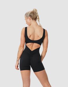 #color_black Backless Athleisure Activewear For Workout, Sporty Backless Workout Activewear, Sporty Backless Gym Activewear, Sports Bodysuit With Low Back And Fitted Design, Stretch Activewear With Ruched Back For Workout, Black Sporty Backless Swimwear, Sporty Black Backless Swimwear, Workout Activewear With Ruched Back And Stretch, Compressive Black Bodysuit For Workout